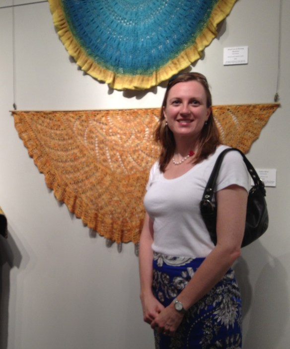 Jill Zarestky, in front of some of her at the current Arts Council of the Brazos Valley exhibition.