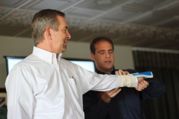 EADC Chair Dr. John Beckerdite '76, getting his "injury" set by Adam Laubach.