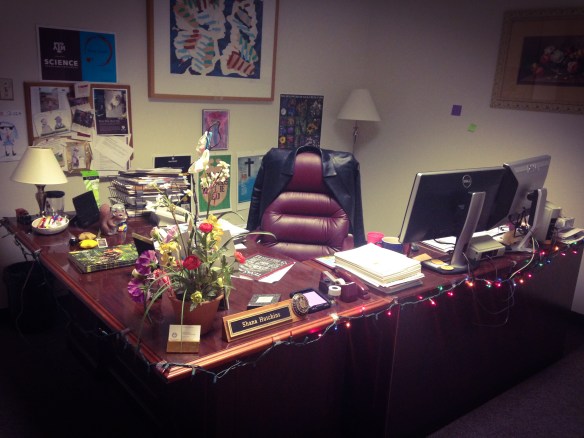 Yep, this is where the magic happens. Probably fitting that half the lights running the desk's perimeter are non-functional (notice I didn't say burnt out!) At least the one at my branch office is cleaner. Never mind it's my husband's.