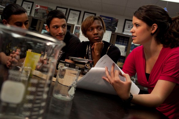 Patricia Oliver '11 (right), accumulating extra classroom experience as a Texas A&M undergraduate and aggieTEACH participant. The program, a collaboration between the College of Science and the College of Education and Human Development, has helped Texas A&M lead the State of Texas in number of university-certified math and science teachers produced each year for nearly a decade. (Credit: Robb Kendrick/Texas A&M Foundation.) 